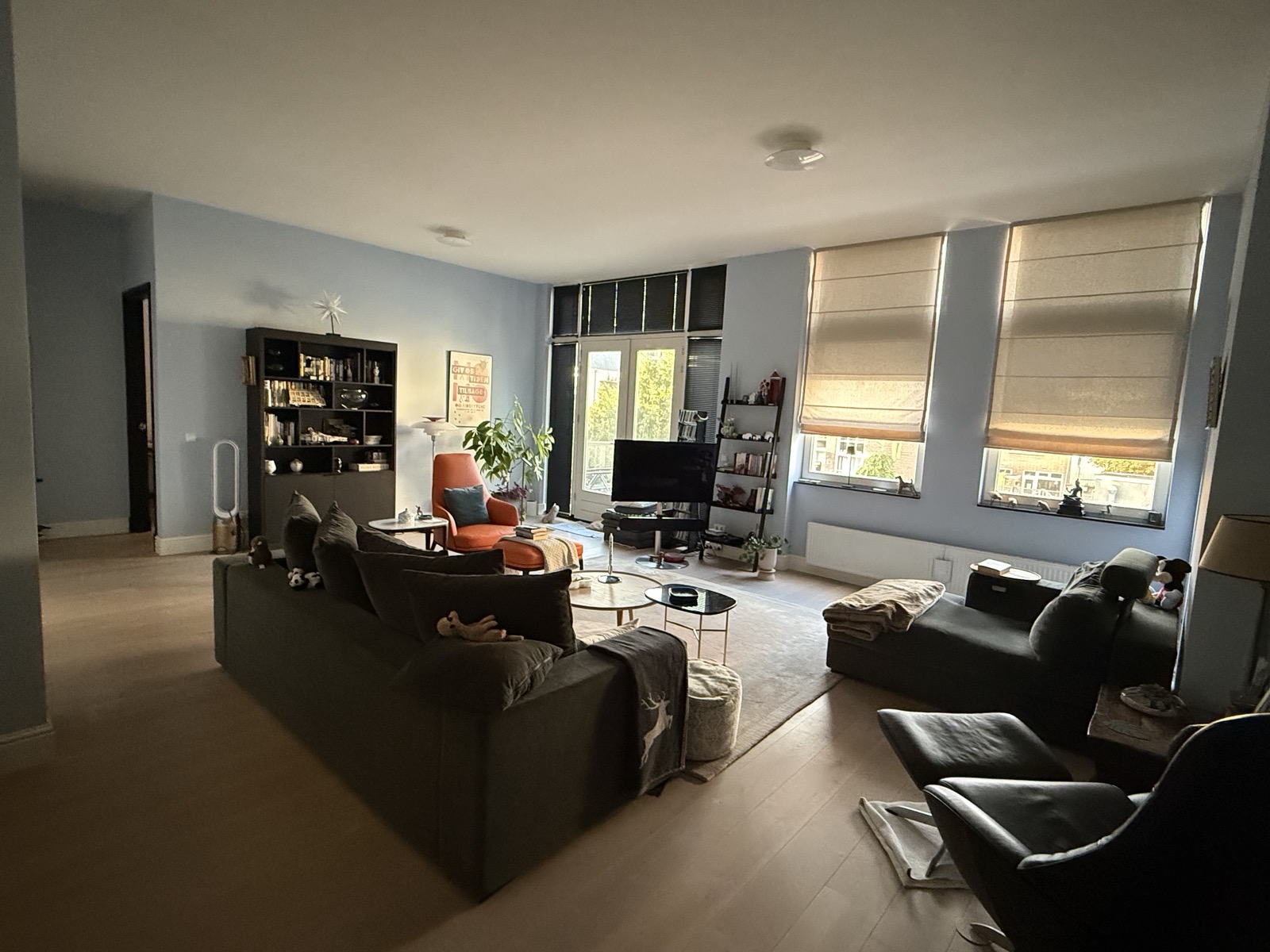 Our living room with seating and balcony access